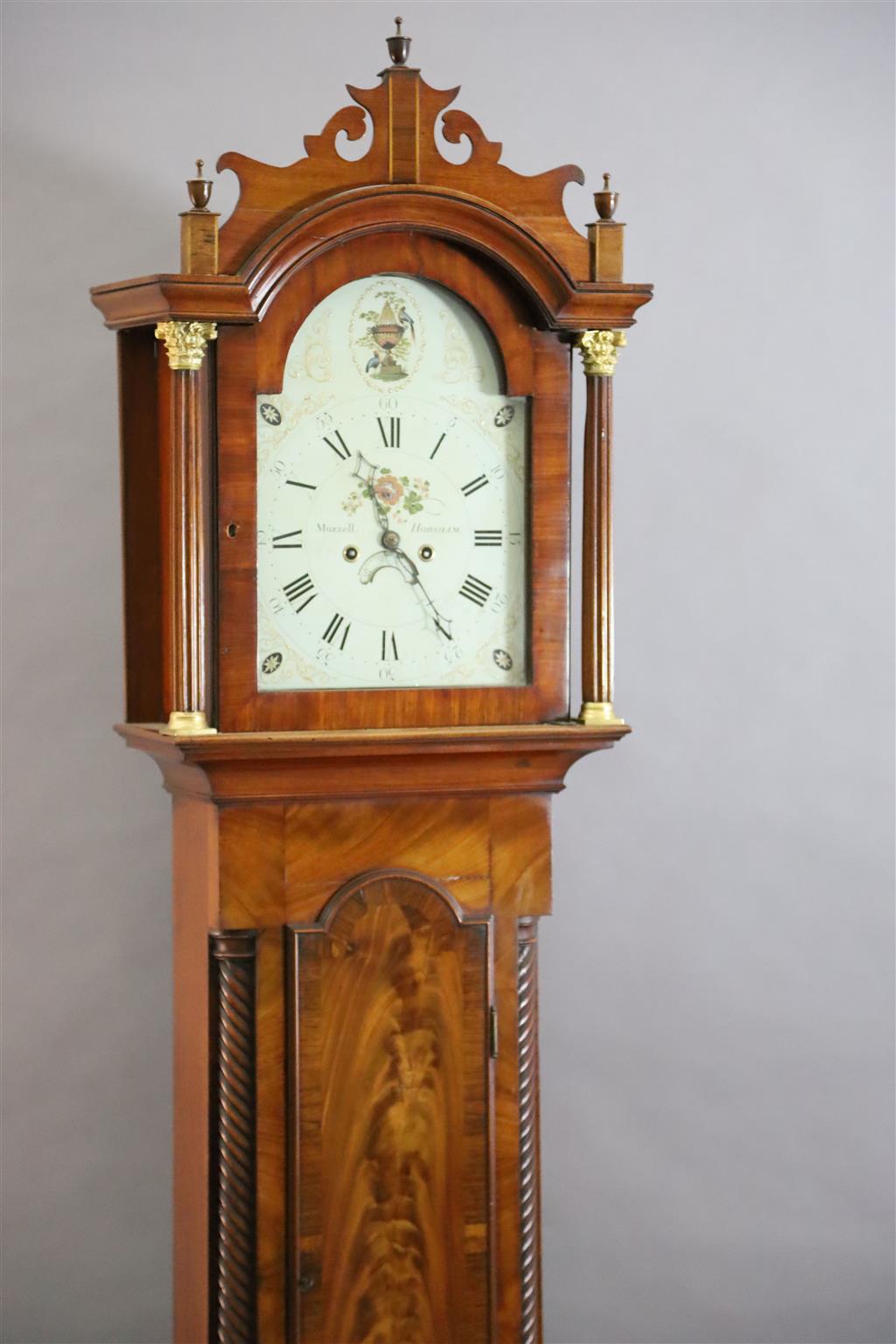 Muzzell of Horsham. An early 19th century mahogany eight day longcase clock, H.7ft 5in.